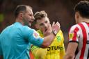 Norwich City midfielder Jacob Sorensen reacts after Luke O'Nien's kiss.