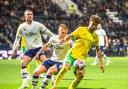 Norwich City's Emiliano Marcondes shields the ball from the Preston North End defenders