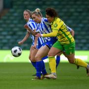 Norwich City's Hope Strauss slows down a Wroxham attack