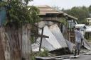 A man surveys the wreckage on his property after the passing of Hurricane Irma, in St. John's, Antigua and Barbuda, on Wednesday. Picture: AP Photo/Johnny Jno-Baptiste