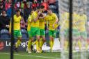 Norwich City celebrate after Kieran Dowell made it 2-0 at Deepdale