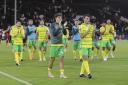 Norwich City players salute the travelling support at Fulham after a Carabao Cup exit