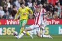 Ante Crnac tussles with Ben Gibson in Norwich City's 1-1 Championship draw at Stoke