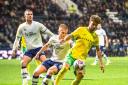 Norwich City's Emiliano Marcondes shields the ball from the Preston North End defenders