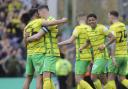 Kenny McLean hugs Norwich City's Championship derby match winner Marcelino Nunez after a 1-0 win over Ipswich Town