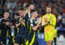 Angus Gunn (right) took responsibility for Portugal's first goal against Scotland