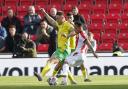 Callum Doyle battles for possession during the 1-1 draw at Stoke