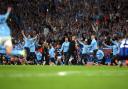 Pep Guardiola, centre, and Manchester City celebrate their Champions League win in 2023 (Martin Rickett/PA)