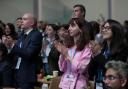 Delegates applaud agreeing on a deal to curb climate change (Joshua A. Bickel/AP)