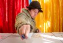 A woman casts her vote in the presidential election in Bucharest, Romania (Andreea Alexandru/AP)