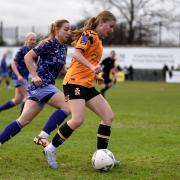 City Women's Lauren Tomlinson slows the Cambridge attack