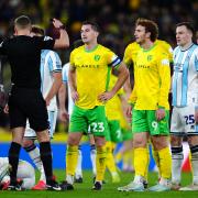 Referee James Bell shows a red card to Norwich City's Kenny McLean during the Sky Bet Championship match at Carrow Road, Norwich. Picture date: Sunday October 27, 2024.