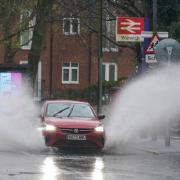 A vehicle is driven through floodwater after heavy rain in Warwick, with more than 200 flood alerts in place in the UK as Storm Bert continues to sweep across the country (Jacob King/PA)