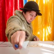 A woman casts her vote in the presidential election in Bucharest, Romania (Andreea Alexandru/AP)